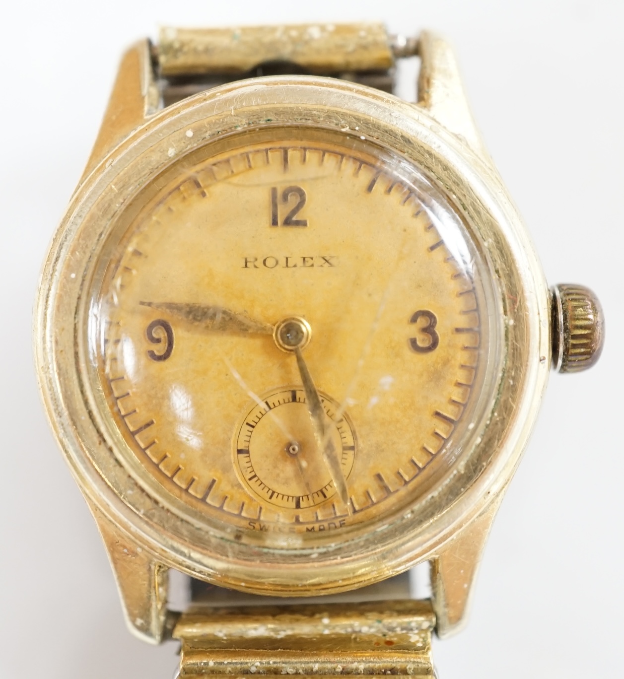 A gentleman's 1940's? mid-size steel and gold plated Rolex manual wind wrist watch, case diameter 30mm, on an associated flexible bracelet, with a Rolex box. Condition - poor